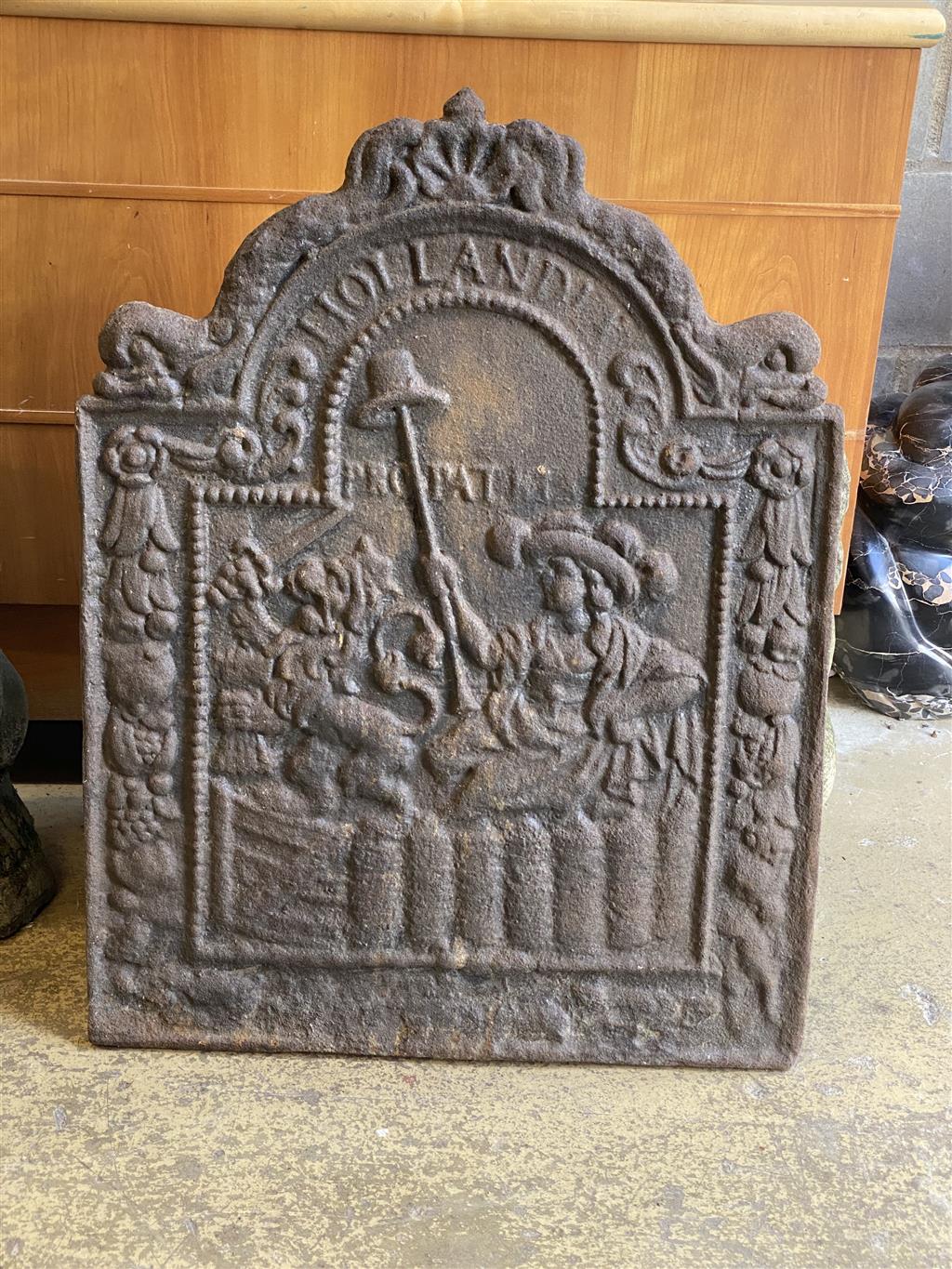 A cast iron fireback, width 54cm, height 70cm